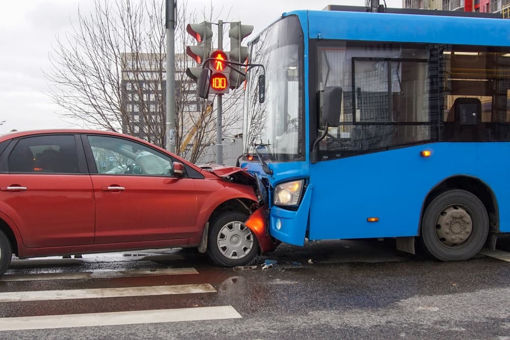 Head-on collision between bus and car. Car accident