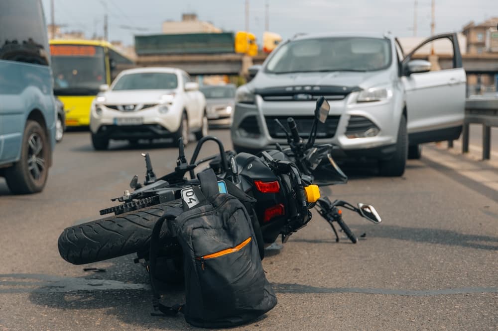 A motorcycle rests on the sidewalk after a serious accident. Close-up of the scene.






