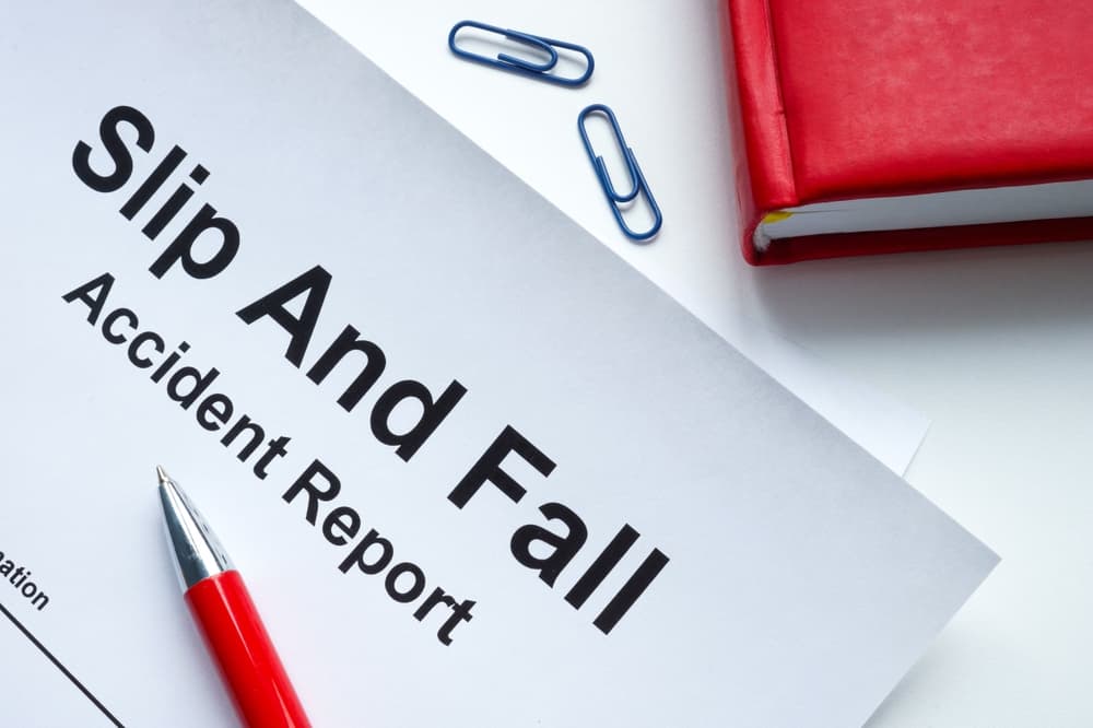 A slip and fall accident report on a notepad, with details about the incident, injuries, and other relevant information for documentation.