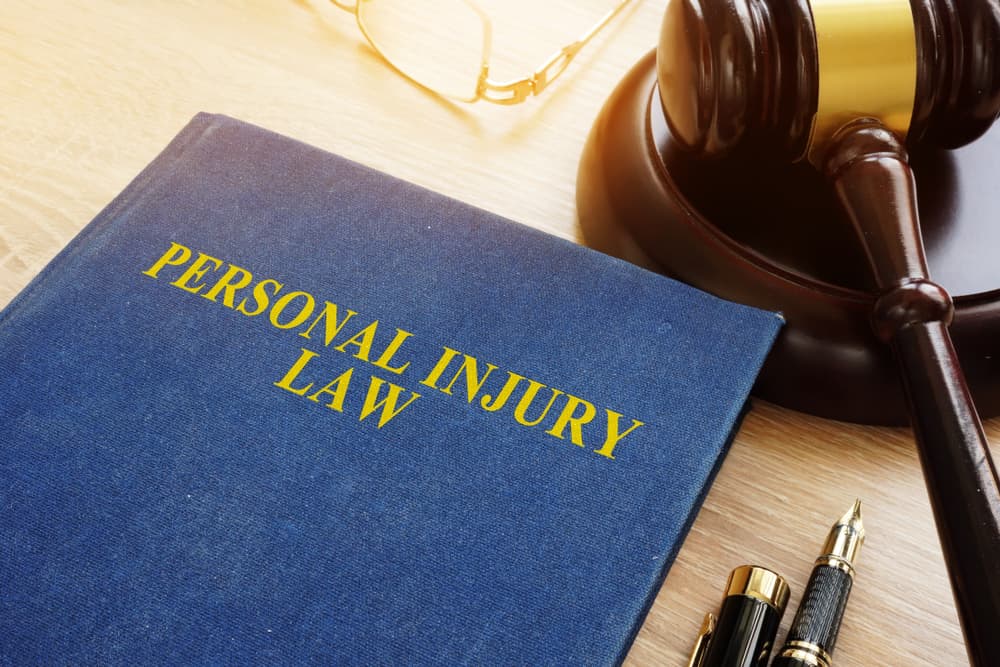 Gavel and legal documents on a desk representing personal injury law.